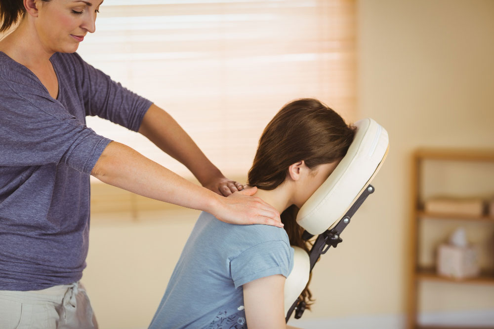 Reflexología y digitopuntura en silla ergonómica